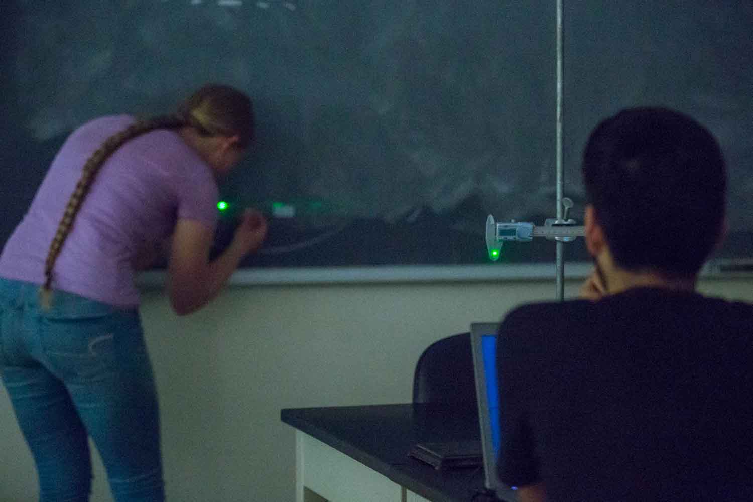 Two students working in a lab together